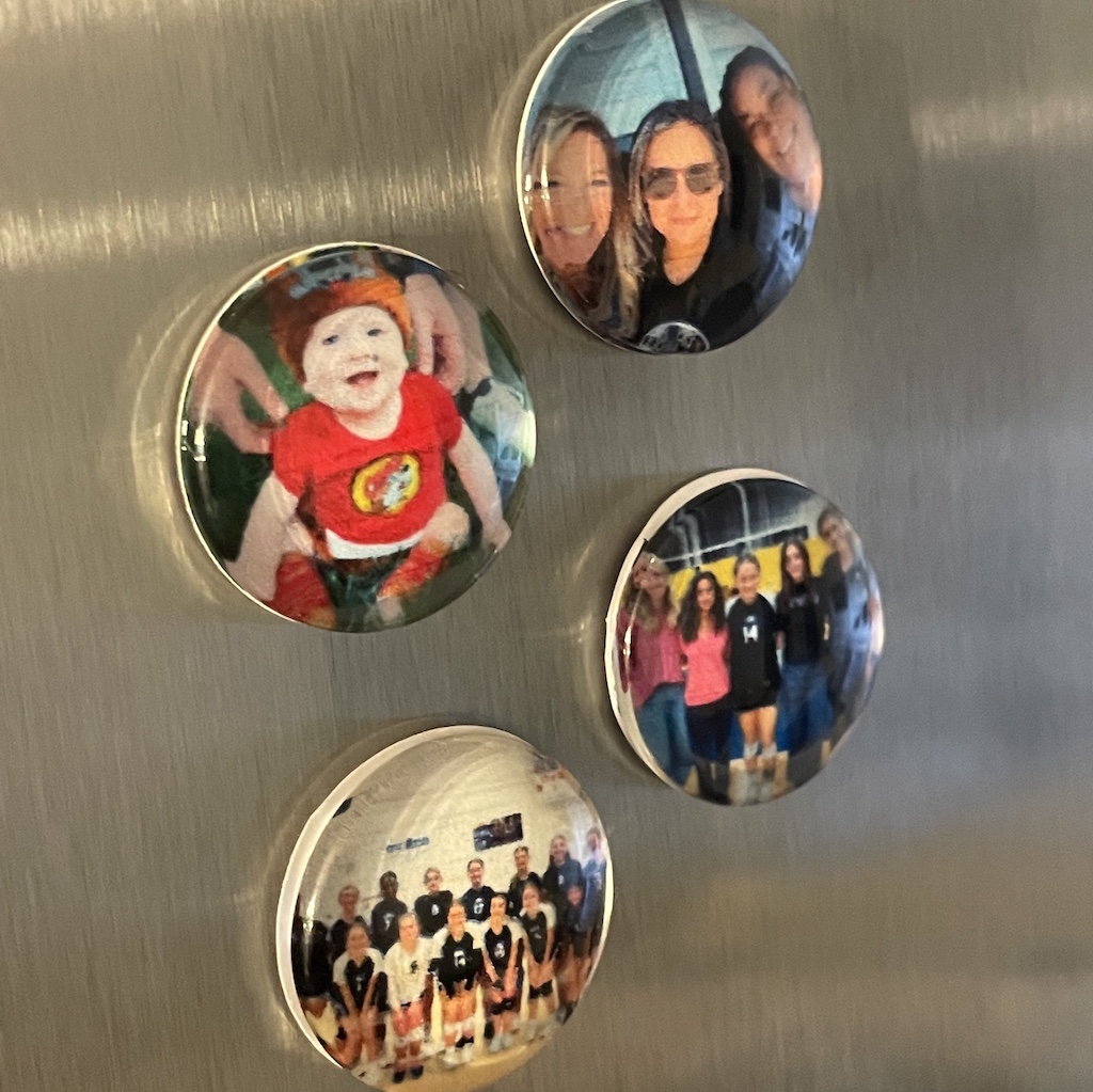 Custom magnets on a fridge